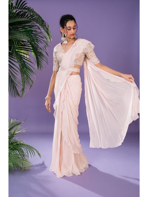 Pritika Vora -  light peach ruffle sare with multi coloured elbow sleeve blouse and belt