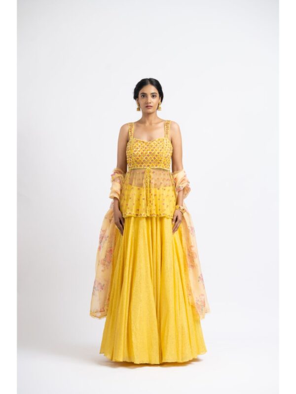 Nikita Gujral- BRIGHT YELLOW NET PEPLUM WITH GEORGETTE MOKAISH LEHENGA AND PRINTED DUPATTA