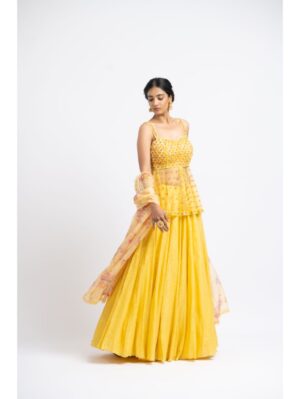 Nikita Gujral- BRIGHT YELLOW NET PEPLUM WITH GEORGETTE MOKAISH LEHENGA AND PRINTED DUPATTA - Image 2