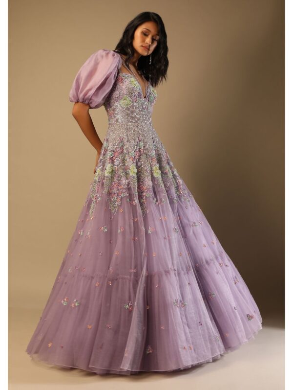 Kalki - Lilac Mauve Gown In Net With Multi Colored Beads Embroidered Floral Motifs And A Puff Sleeves Organza Shrug