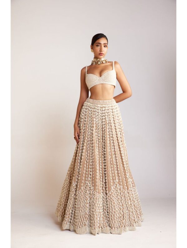 Vvani Vats - Beige chandelier pearl lehenga paired with sleeveless pearl drop sweetheart neck blouse