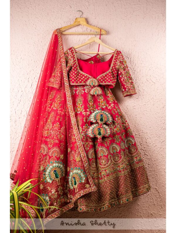 Anisha Shetty - STRAWBERRY PINK EMBROIDERED BRIDAL LEHENGA SET WITH PEACOCK & ELEPHANT DETAILS