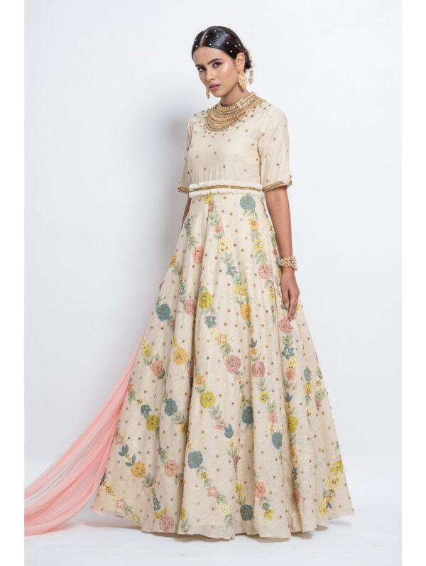 Abstract by Megha - Featuring a floor length stand collar circular gown