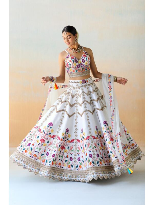 Aman Takyar - white lehenga set in raw silk base featuring mutli-colored floral thread embroidery