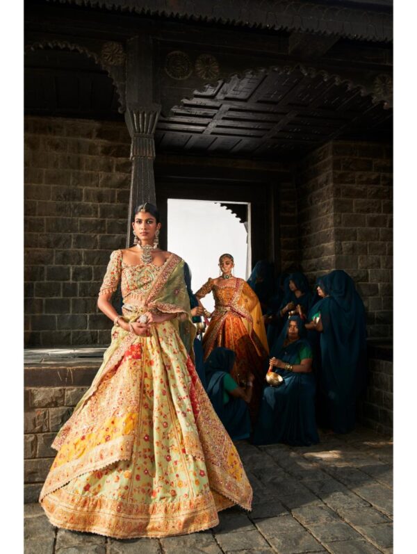 Aditi Gupta - Pista Kani Silk lehenga set featuring blouse, sleeveless blouse